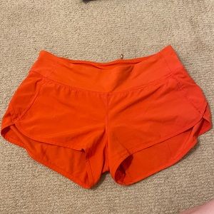 Orange Lululemon shorts size 6.